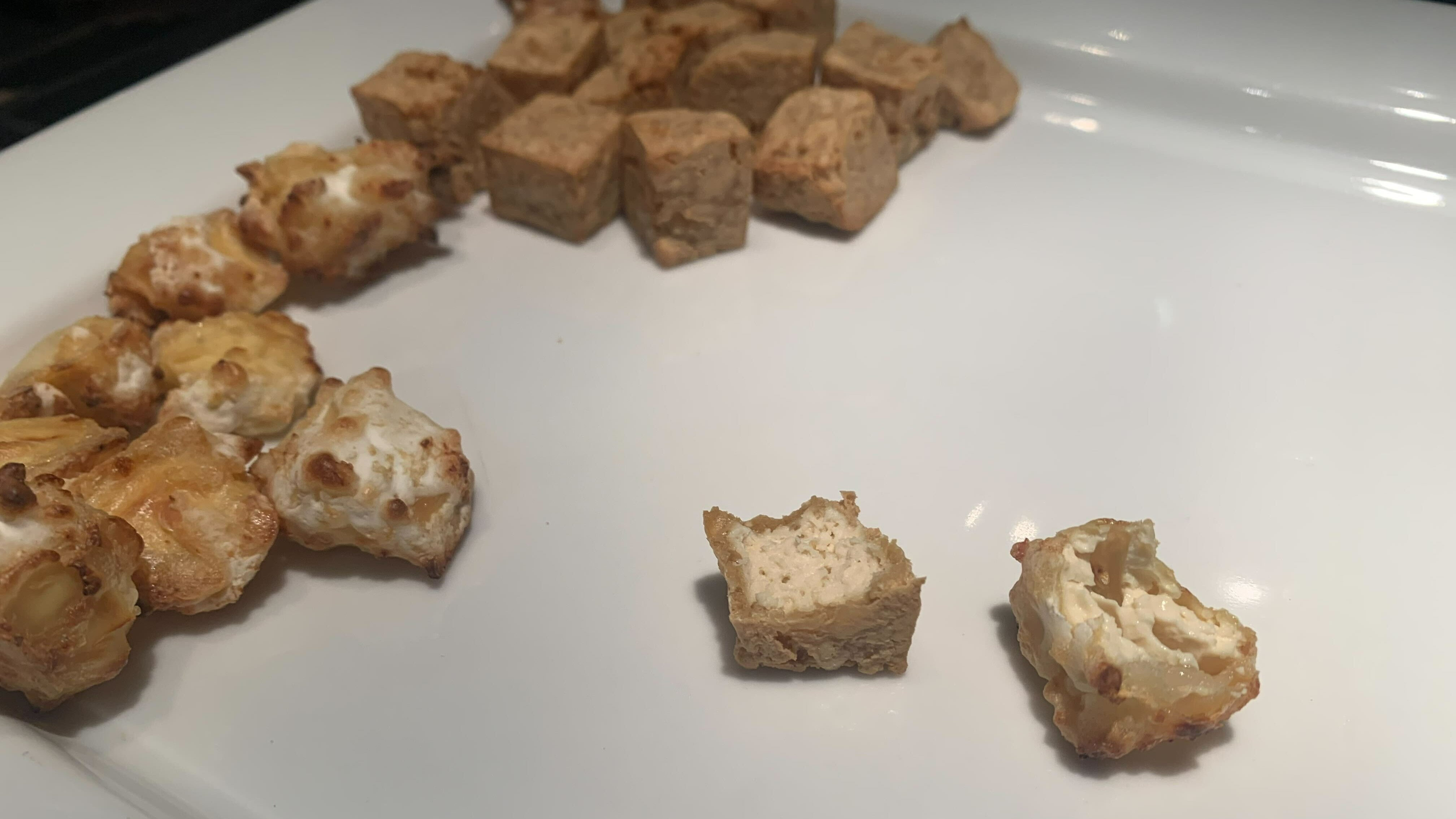 Cooked tofu. The silky tofu (right) has layers and a thinner crisp. The spongier tofu (left) has a thicker crust and denser tofu texture