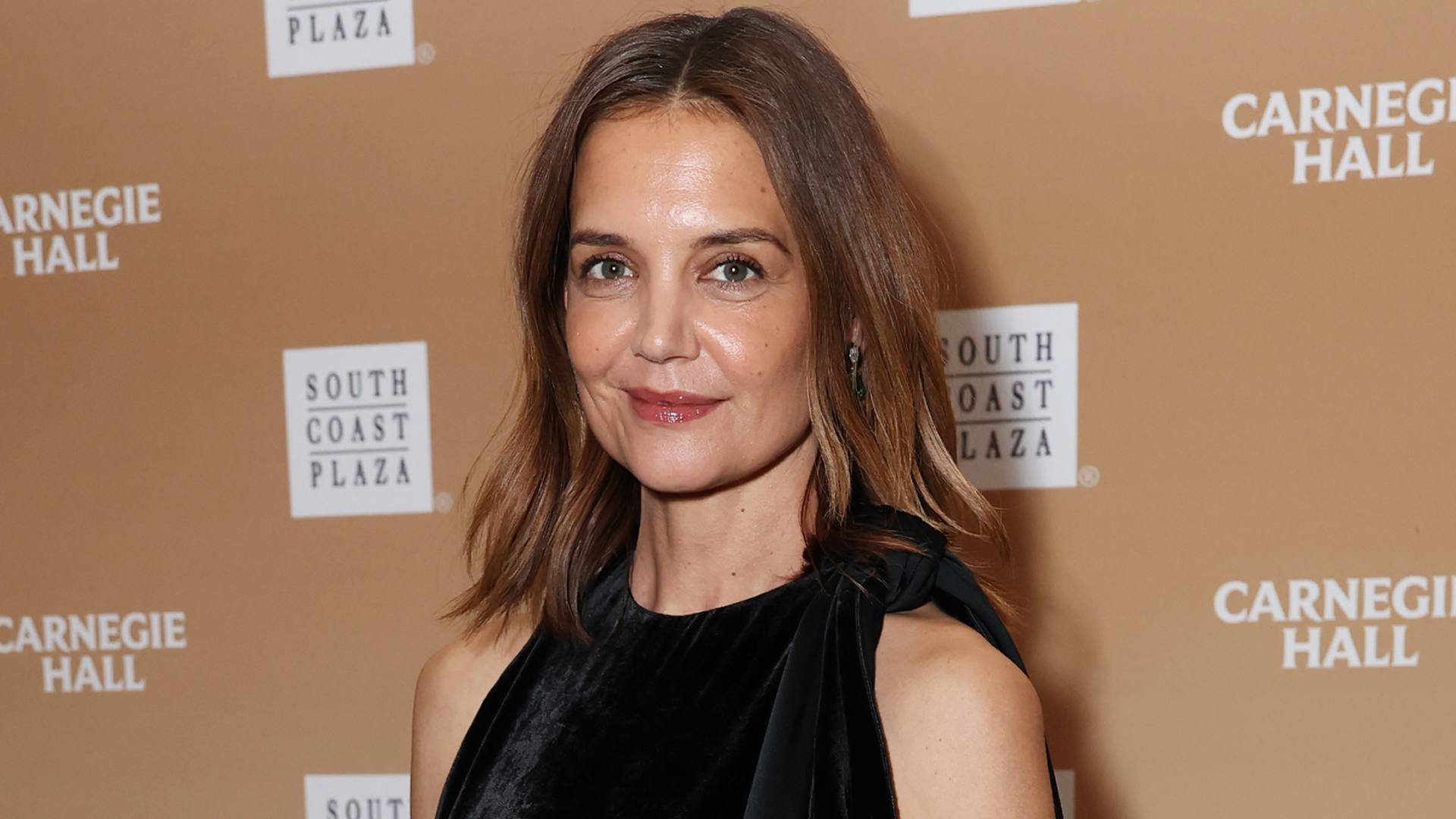 Katie Holmes wore a fringed little black dress with the peep-toe pumps trend