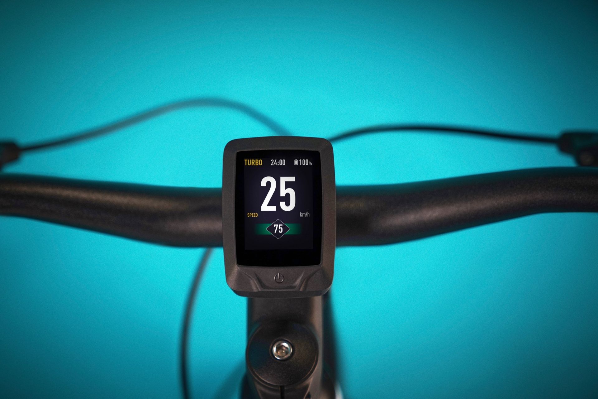 The Specialized Tero X Master Mind display unit nestled on the bars of the bike on a blue background