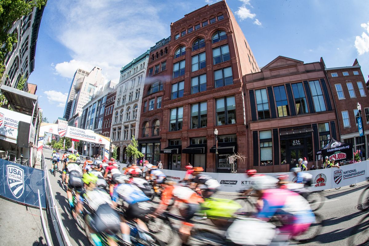 The women pass through downtown Louisville