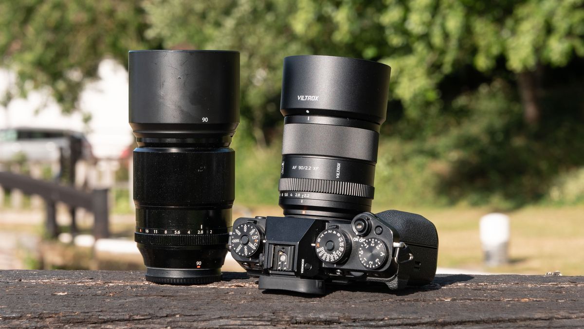 Viltrox AF 90mm f/2.2 EVO lens attached to a Fujifilm X-T5 camera, alongside the Fujifilm XF 90mm f/2 lens
