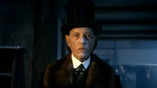 Richard E. Grant wearing a top hat in Doctor Who.