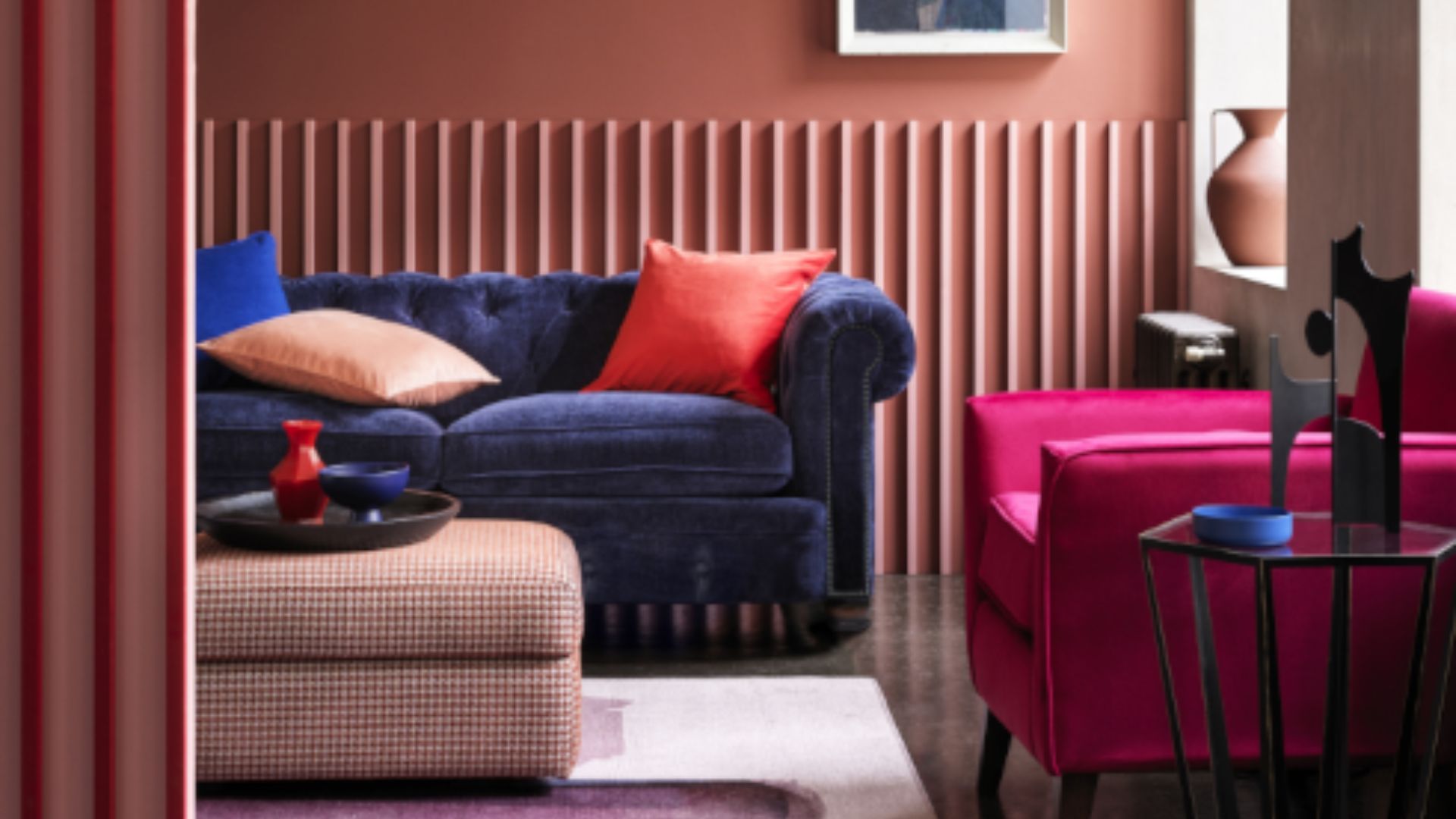 picture of blue velvet sofa in colourful room set up