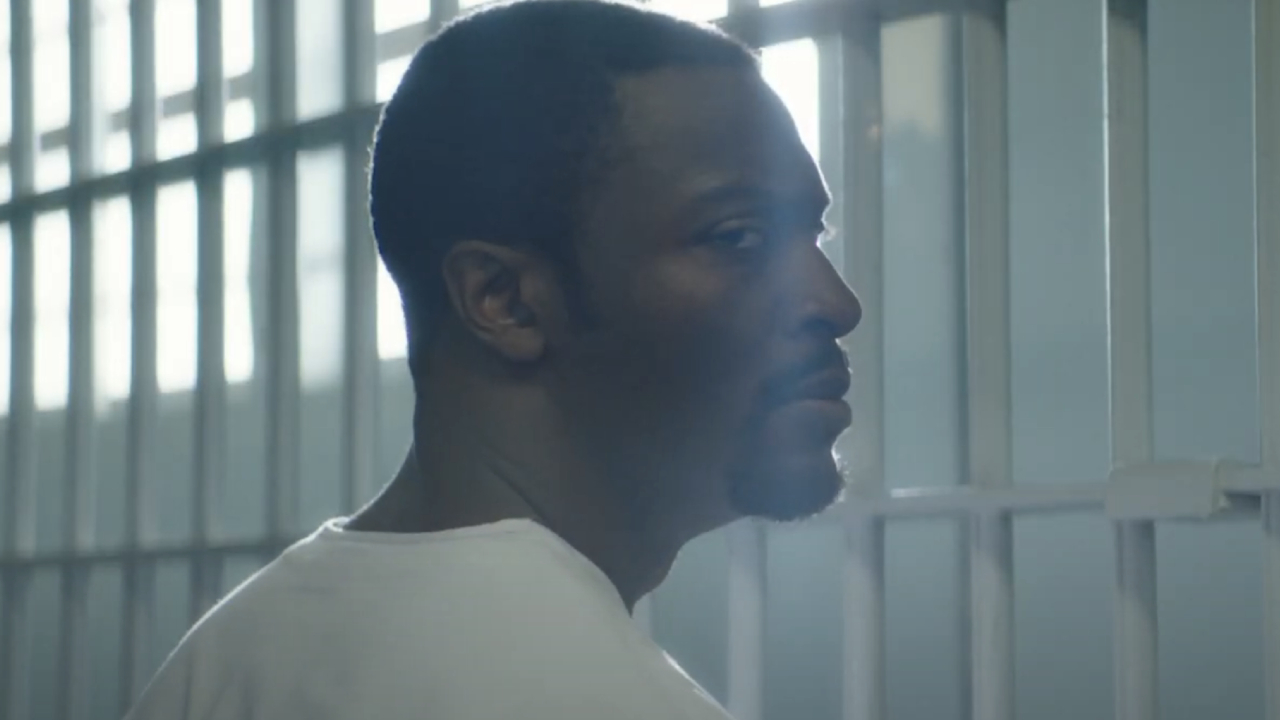 Aldis Hodge standing in a prison cell in Clemency