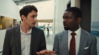 James Franco carries on a conversation with David Oyelowo as they walk down a hallway in Rise of the Planet of the Apes.