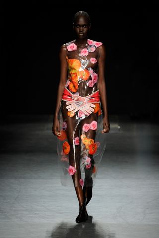 Model on the runway at London Fashion Week S/S 2023 wearing Christopher Kane