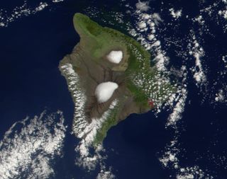 Hawaii's Big Island volcanoes include Mauna Kea (top center) Mauna Loa (center) and Kilauea, whose Pu'u 'O'o cone is outlined in red. The image was taken in February 2002 with NASA's Terra satellite.