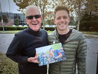 Specialized founder Mike Sinyard (left) stands with Luke Lamperti holding photo when the two met more than 12 years ago at Levi's GranFondo