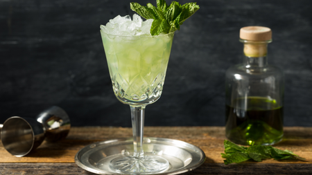 Absinthe cocktail with ice and mint.