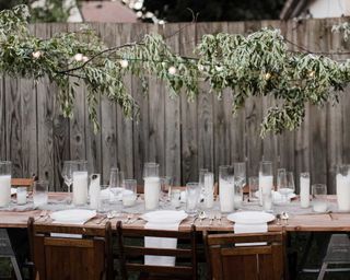 table setting with candles and foliage