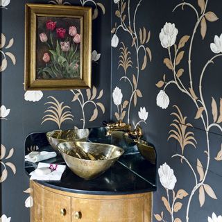 bathroom with wallpaper on wall and wash basin near soap