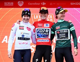 Anna van der Breggen, Demi Vollering, and Marianne Vos in the combativity, leader's, and points jerseys at the end of La Vuelta Femenina 2025