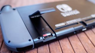 Nintendo Switch microSD card slot open with microSD card inside