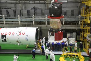 The Russian Soyuz spacecraft that will carry Japanese billionaire Yusaku Maezawa, video producer Yozo Hirano and cosmonaut Alexander Misurkin to the International Space Station undergoes pre-launch processing. Launch of the trio's mission is scheduled for Dec. 8, 2021.
