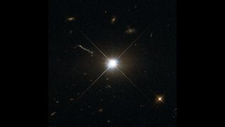 the largest quasar collection, LG-Q, looking like a large, twinkling brightly glowing white star