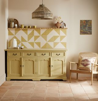 soft yellow kitchen with yellow and white geo tile backsplash