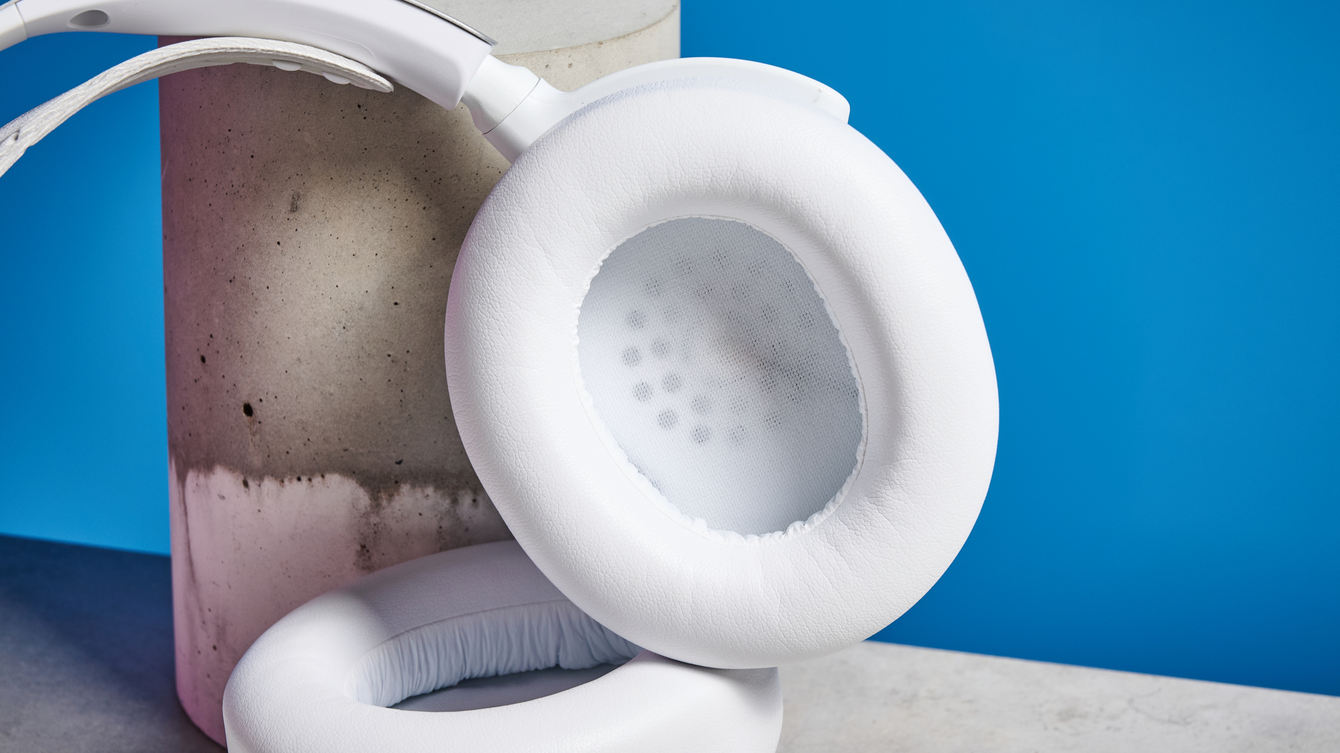 SteelSeries Arctis Nova Pro Wireless in white on a stone surface 