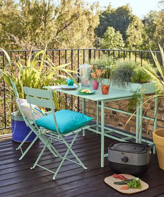 colorful table and chair in a balcony garden