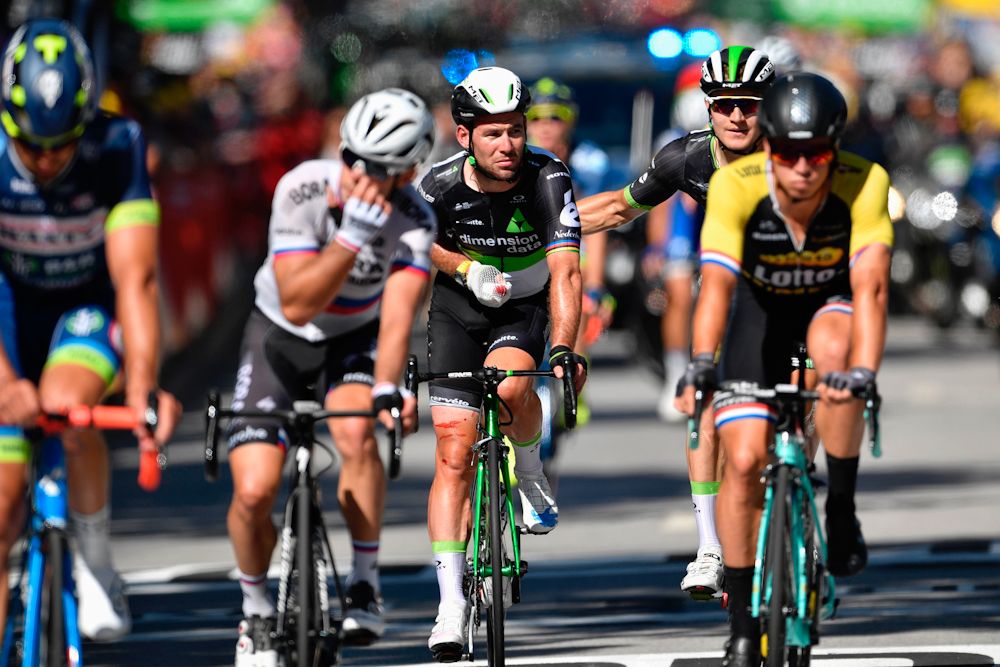 Mark Cavendish rides to the finish after crashing in the finale of stage 4 at the Tour de France