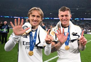 Luka Modric and Toni Kroos of Real Madrid celebrate with their medals after winning the 2024 Champions League final against Borussia Dortmund