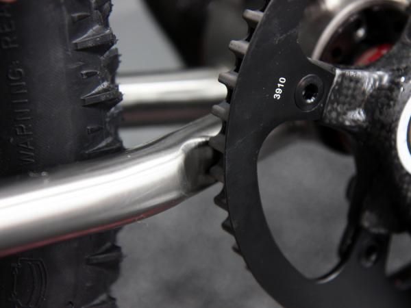 Gates' thick belt-drive chainring requires a small dimple on this Ti Cycles chain stay.