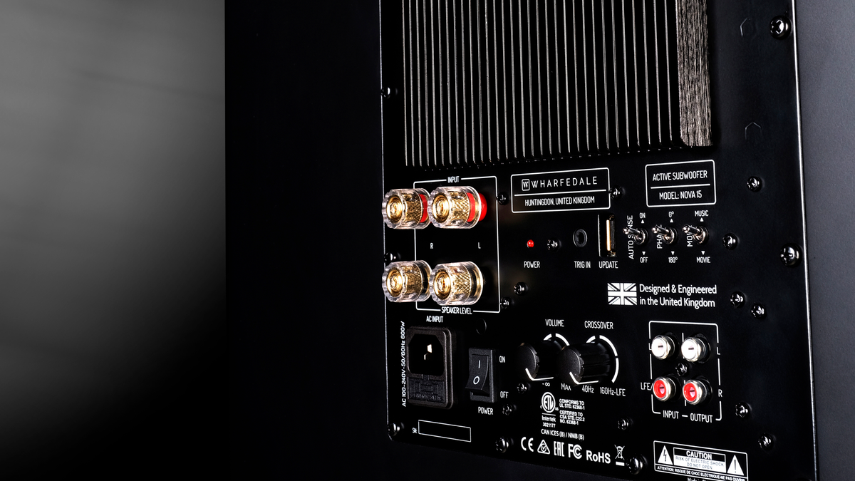 Rear view of the Wharfedale Nova 15 showing its connections and controls on a dark gradient background