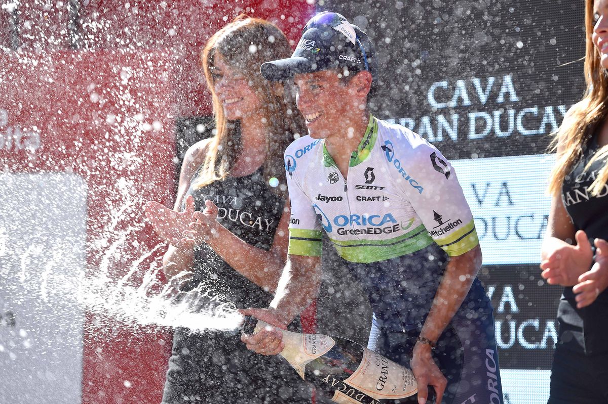Estaban Chaves celebrates on the podium after stage 6.