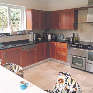 Brown L shaped kitchen reconfiguration