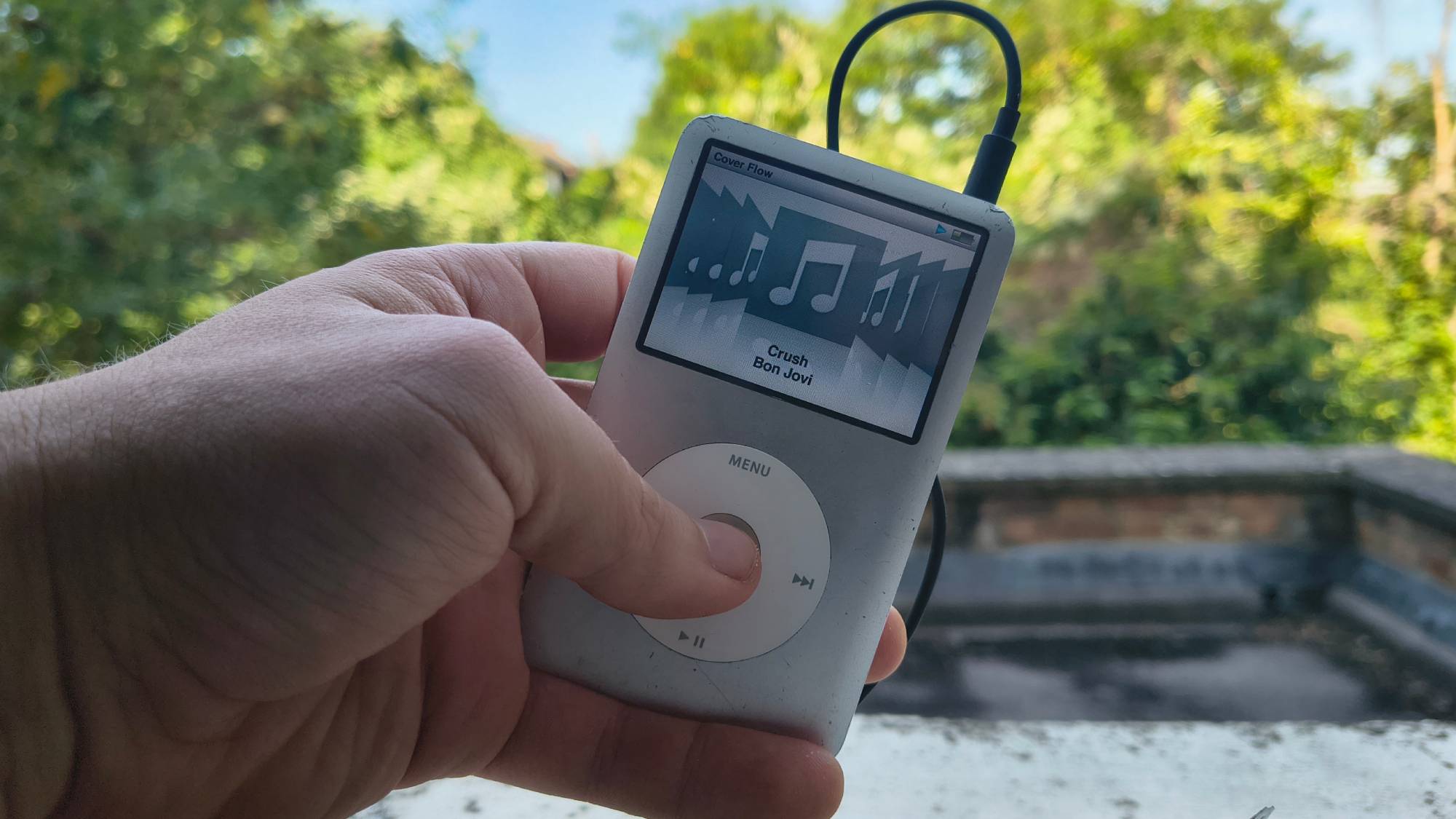The iPod Classic on a window sill.