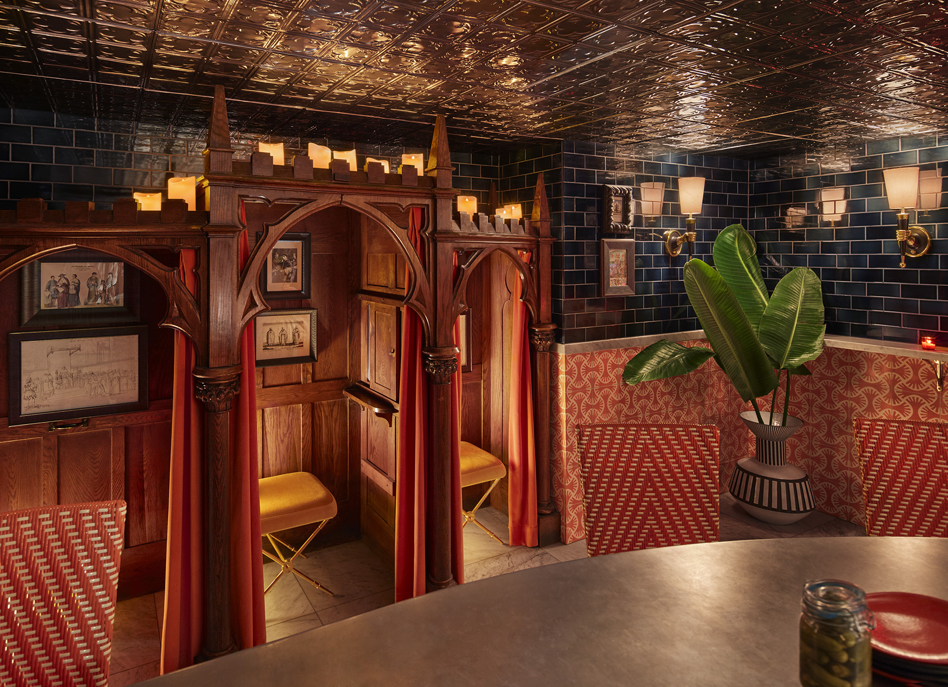 An antique confessional stands in the back of Counter Reformation wine bar at Parker Palm Springs