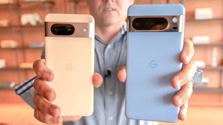 Google Pixel 8 and Pixel 8 Pro held in the hand.