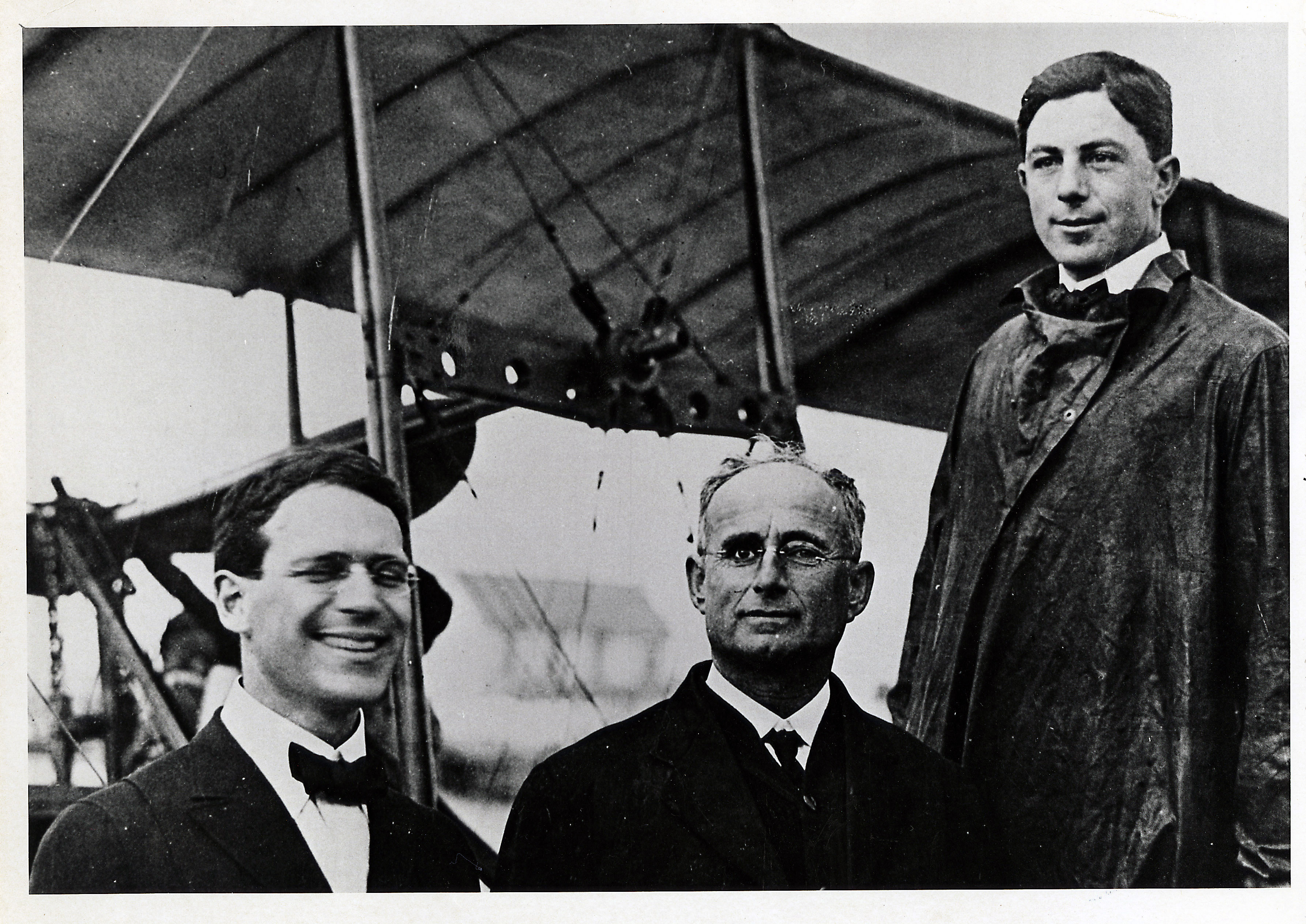 Photo of Percival Elliott Fansler, Abram C. Pheil, and Tony Jannus pose before the inaugural flight of the St. Petersburg-Tampa Airboat Line — the world's first airline.