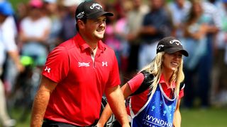 Reed and Justine walk up the 18th hole before victory at the 2013 Wyndham Championship