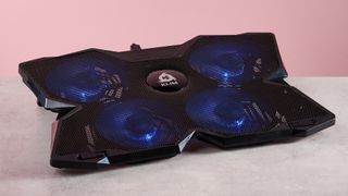 The Klim Wind from a 3/4s angle in front of a pink background.