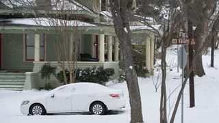 A parked car covered in snow in McKinney, Texas, U.S., on Tuesday, Feb. 16, 2021.