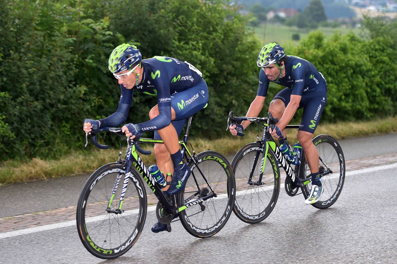 Movistar's Adriano Malori tries to pull Francisco Ventoso into the lead group