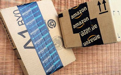 West Palm Beach, USA - June 30, 2016: Amazon packing tape on Amazon.com shipping packages. One box is sealed with Amazon Prime packing tape.Amazon Prime is the premium subscription service th