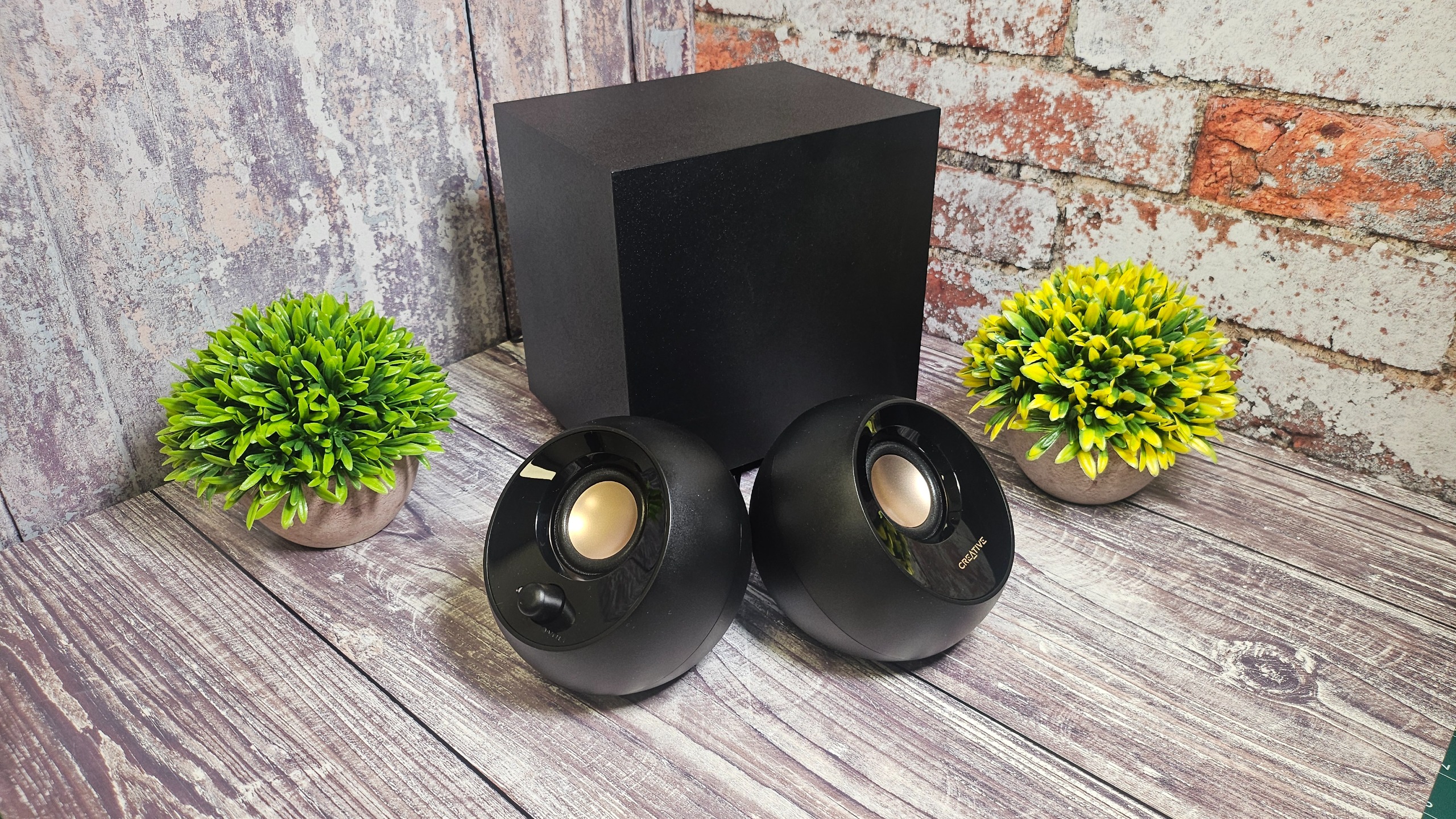 The Creative Pebble Plus speakers with their subwoofer