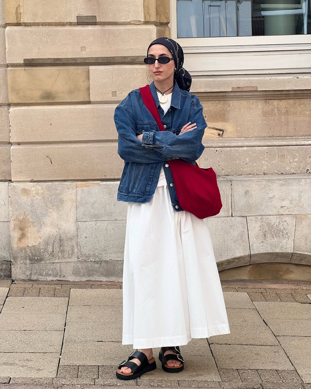 Amira wears white full skirt and denim jacket
