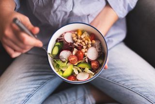 Eating disorder symptoms: A woman with a salad