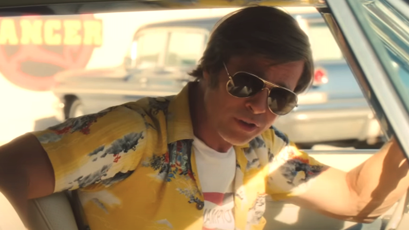 Brad Pitt as Rick Dalton looking out side window in Once Upon A Time In Hollywood