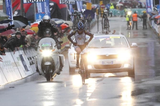 Elisa Longo Borghini (Hitec Products) adjusts her jersey before giving a victory salute
