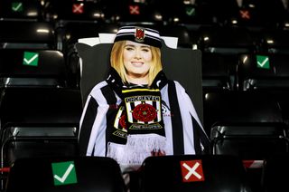 A cardboard cutout of Adele in the stands at Victory Park, Chorley