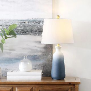 A blue and white table lamp