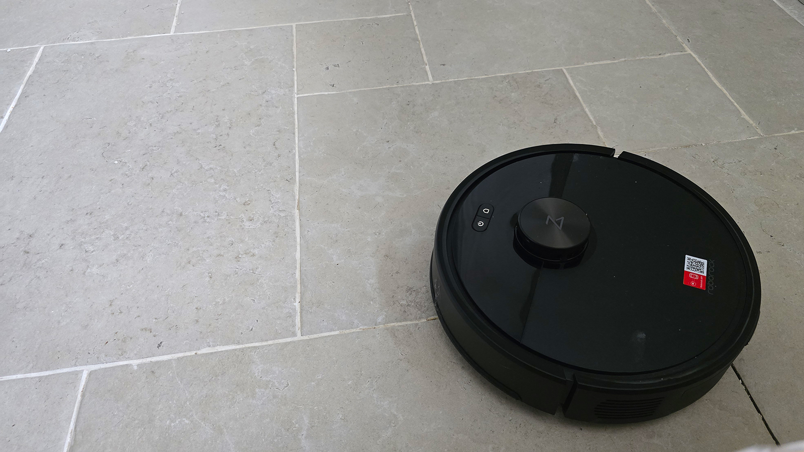 Roborock Q7 M5 cleaning a stone kitchen floor