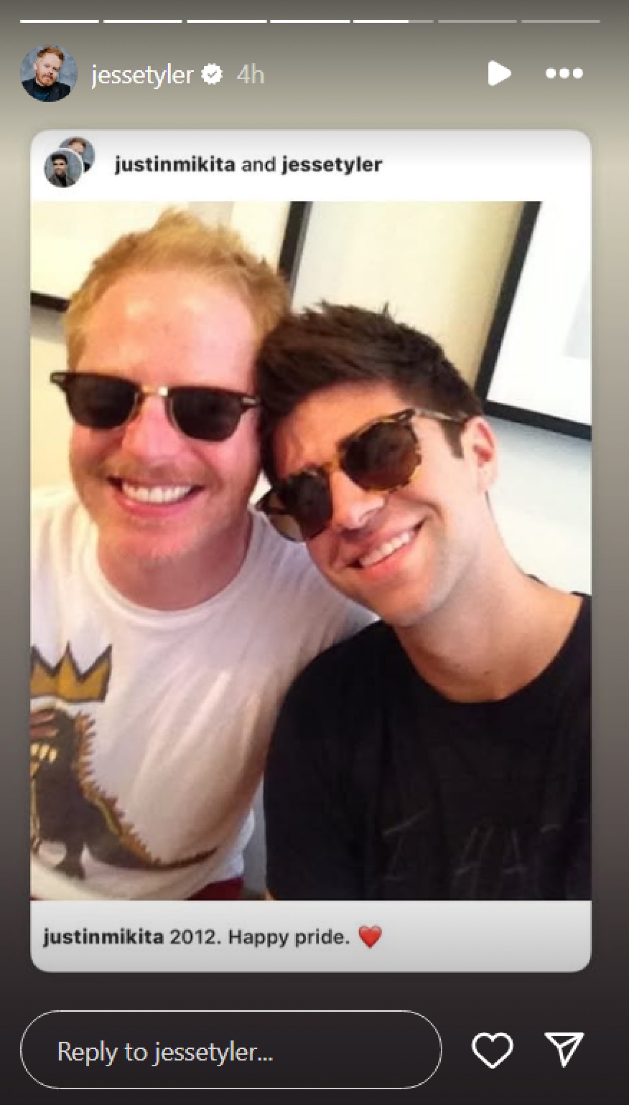 Jesse Tyler Ferguson shares a 2012 photo of himself with husband Justin Mikita.