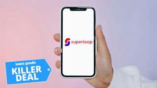 Hand holding phone with Superloop logo on it and Tom's Guide deal badge on bottom left corner
