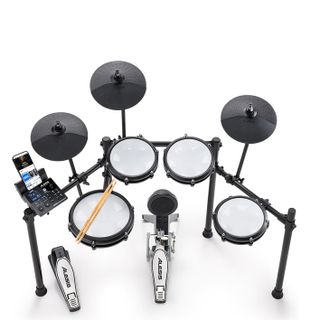 Overhead of an Alesis Nitro Max electronic drum kit on a white floor