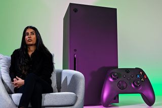 Asha Sharma, CEO of Xbox with an Xbox Series X background photo