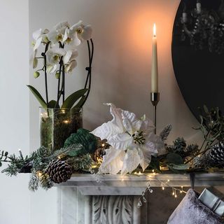 Marble mantle piece with Christmas decoration and lights